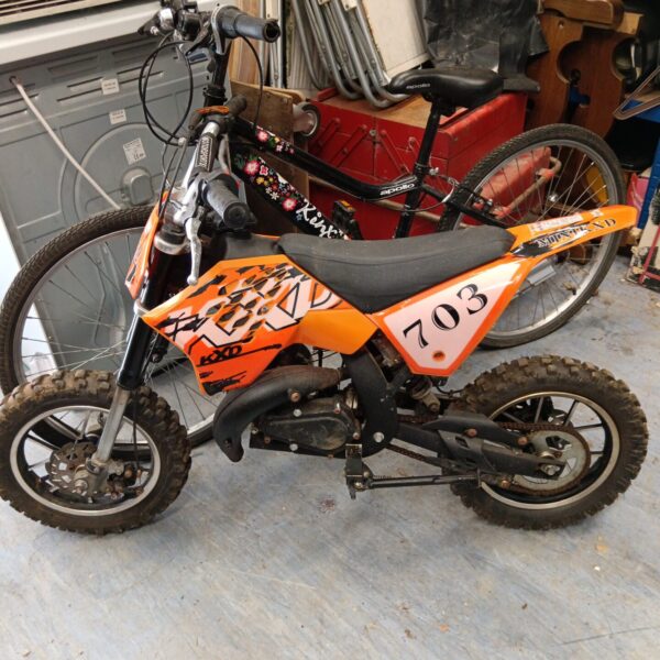 Child's 2-stroke crosser bike, KXd model, for off-road fun.