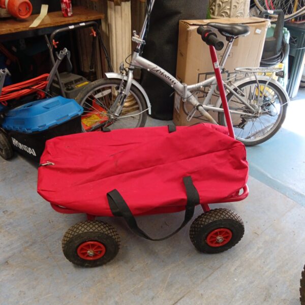 Red festival camping trolley with wheels and folding frame.