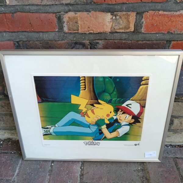 Framed Pokemon lobby card featuring Pikachu and Ash.