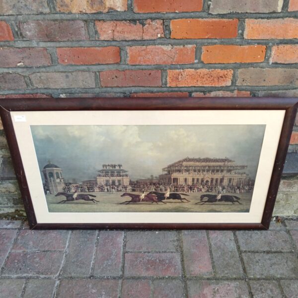 Vintage Doncaster race print showing horses and jockeys racing.