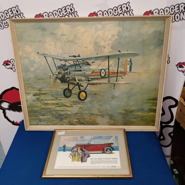 Vintage aviation and ten-four tourer prints in a framed display.
