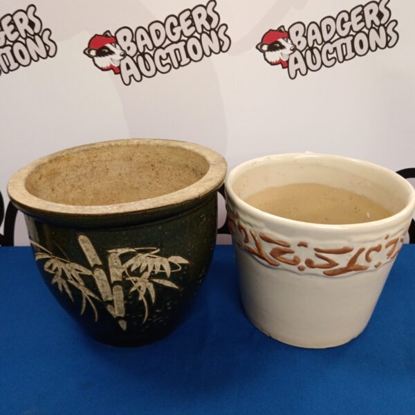 Vintage glazed ceramic plant pots with floral detailing.
