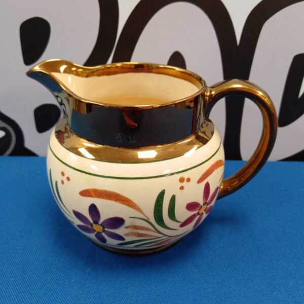 Vintage Wade Harvest jug with floral design and copper lustre.
