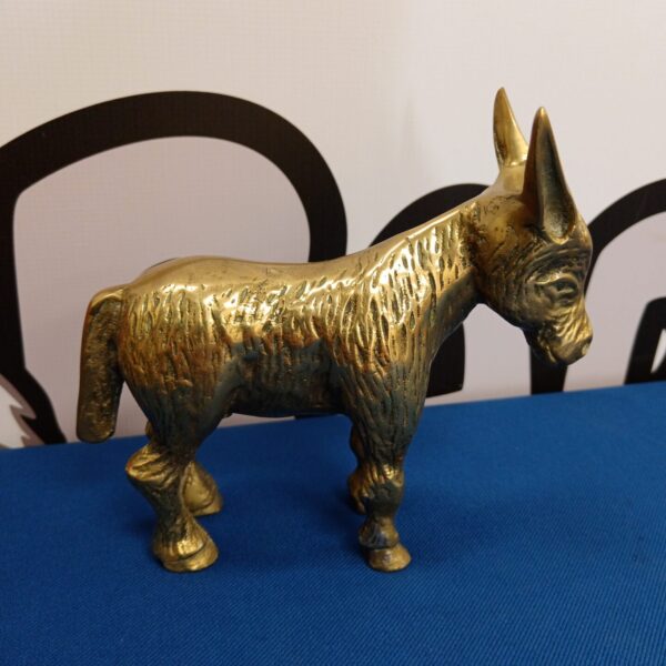 Vintage brass donkey sculpture, detailed animal figurine.