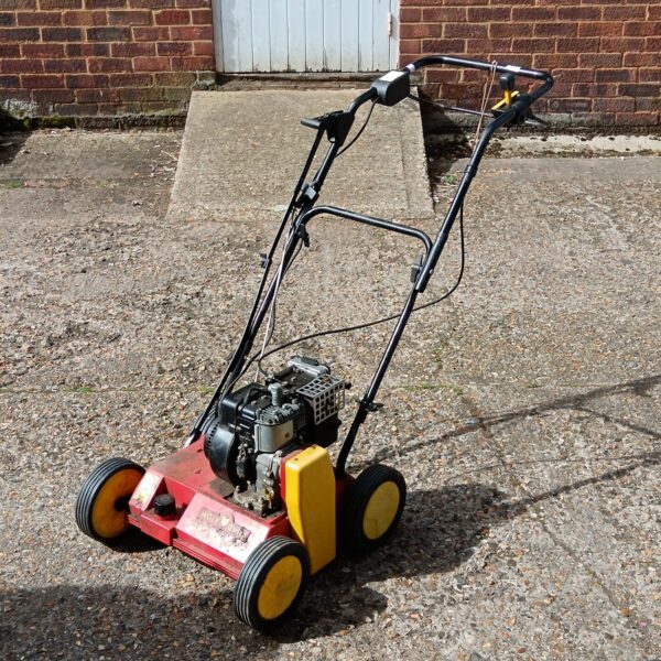 Front view of a Wolf Garten scarifier for lawn maintenance.