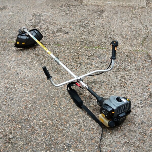 Titan TTL530GBC petrol grass strimmer for garden maintenance.