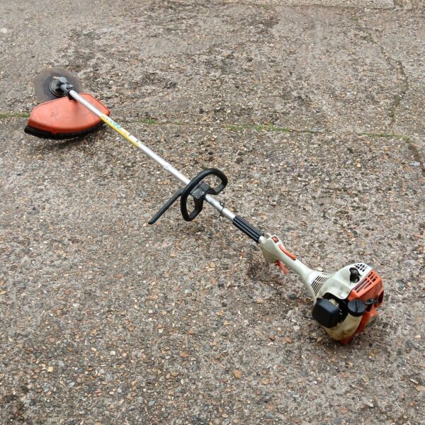 Used Stihl FS55 petrol strimmer for garden maintenance.