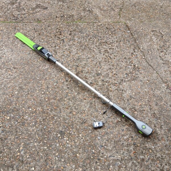Gtech electric pole hedge cutter for garden maintenance.