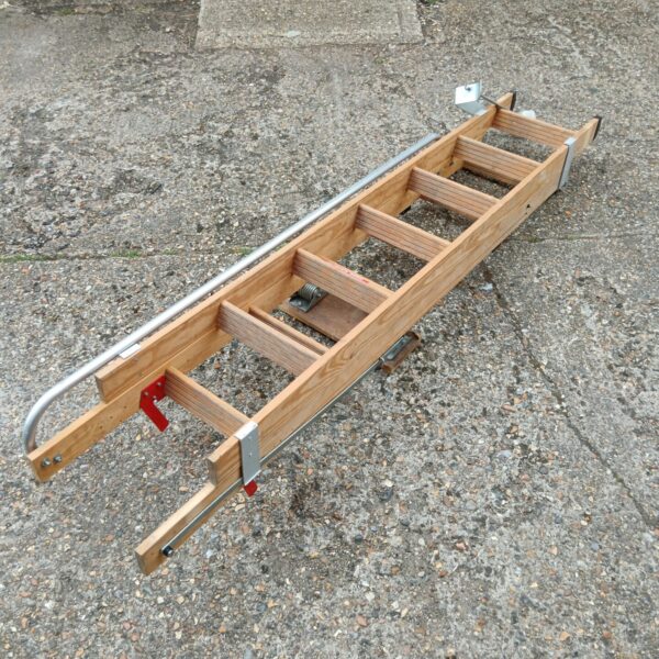 Side view of a vintage wooden loft ladder.