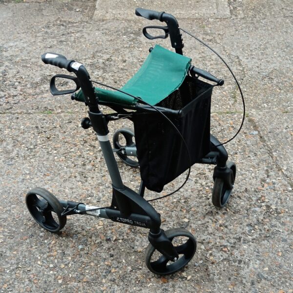 Blue Topro Trojan mobility trolley with shopping bag.