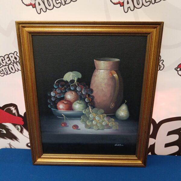 Vintage still life oil painting signed Gadton featuring fruit and a pitcher.