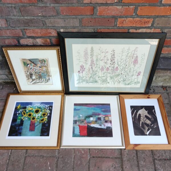 Vintage framed prints lot featuring carnival and floral scenes.
