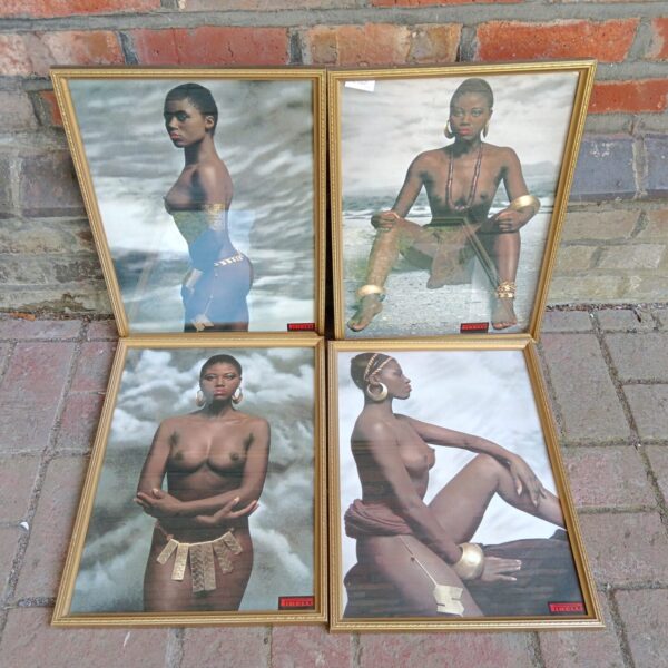 Pirelli calendar print of a topless female figure in artistic pose.