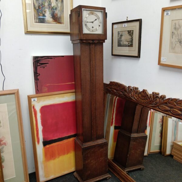 Antique James Walker grandfather clock with mahogany case.
