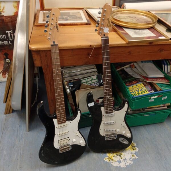 Vintage Yamaha and Encore electric guitars in a lot.