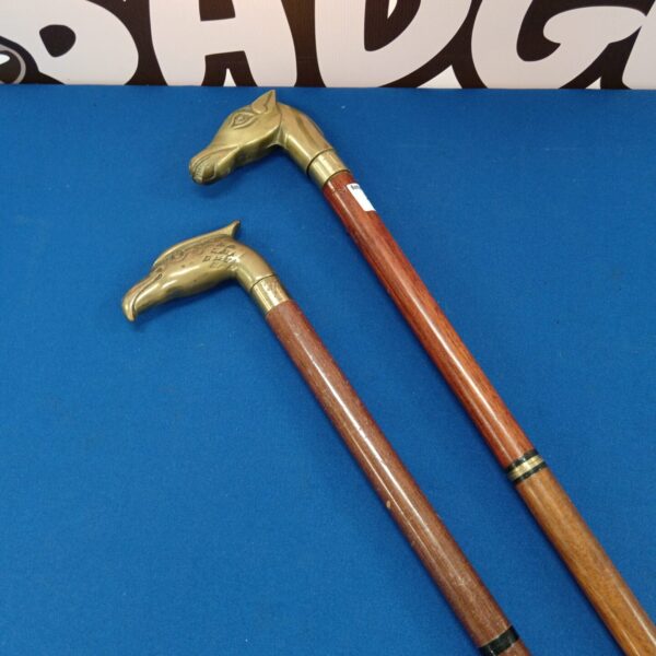 Antique horse head walking stick with brass handle.