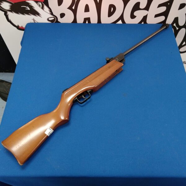 Side view of a Gamo .177 air rifle with wooden stock.
