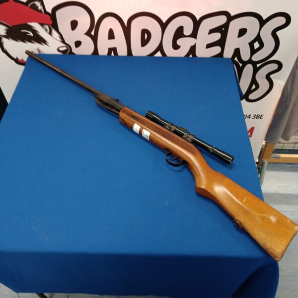 Vintage Hungarian air rifle with scope, a collectible airgun.