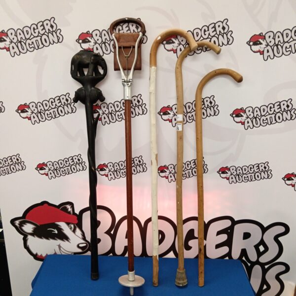 Bundle of vintage walking sticks and shooting stick for collectors.
