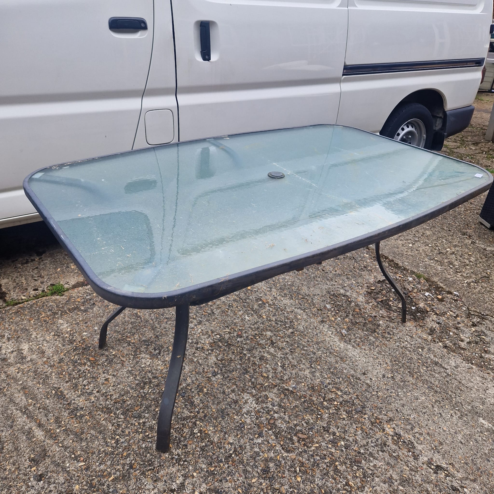 1167 Large glass topped garden table
