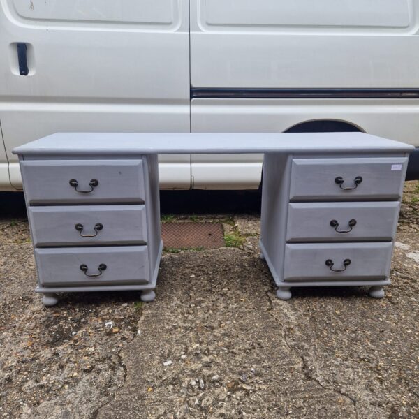 Grey six drawer desk with graduated drawers, vintage style.