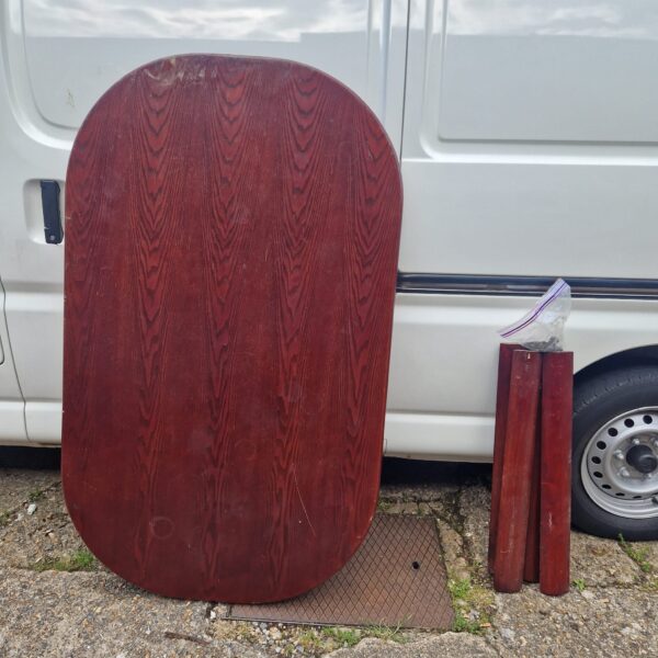 Vintage mahogany dining table with a warm tone.