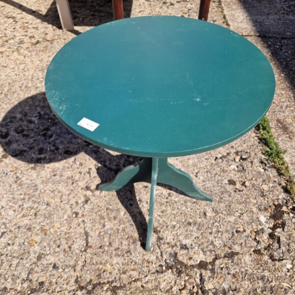 Vintage green side table with tripod legs.