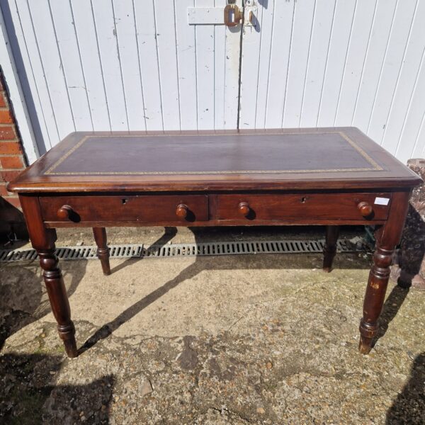 Vintage writing desk with leather top and turned legs.