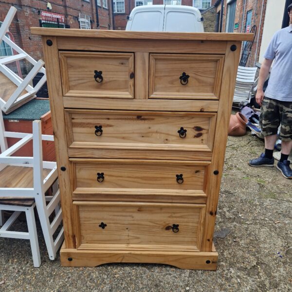 Vintage pine chest of drawers with two over three drawer configuration.