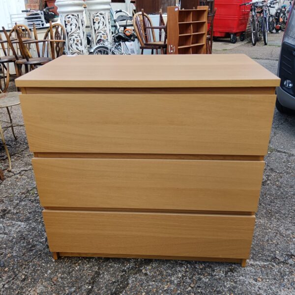 Vintage teak effect three drawer cabinet for storage.