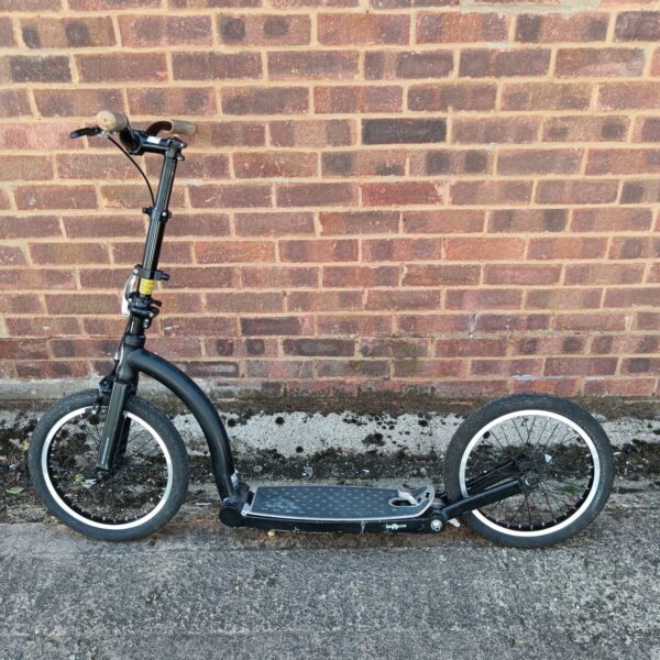 Black Swifty One folding scooter for urban commuting.