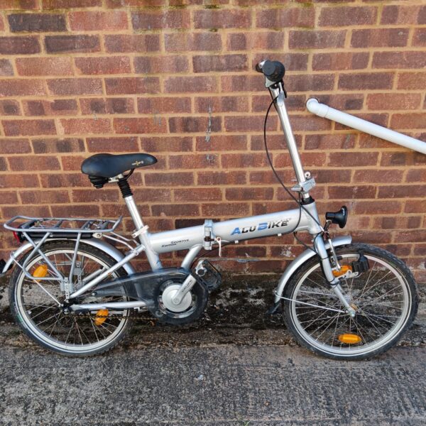 Silver Alu bike folding bicycle with rack and mudguards.