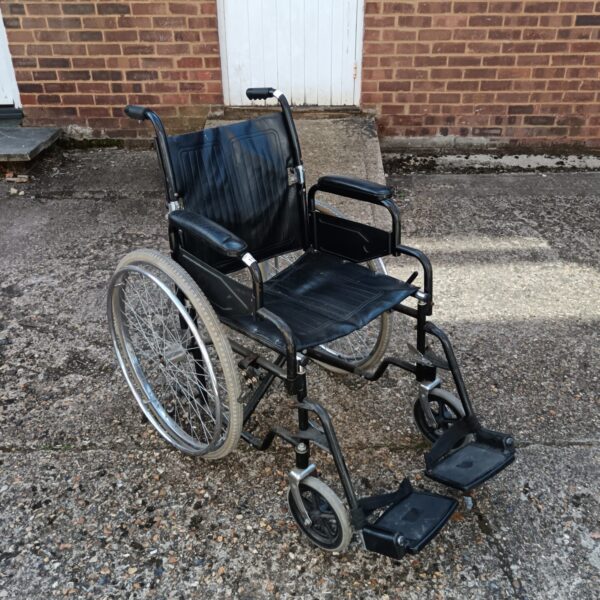 Black folding wheelchair with footrests, a portable mobility aid.