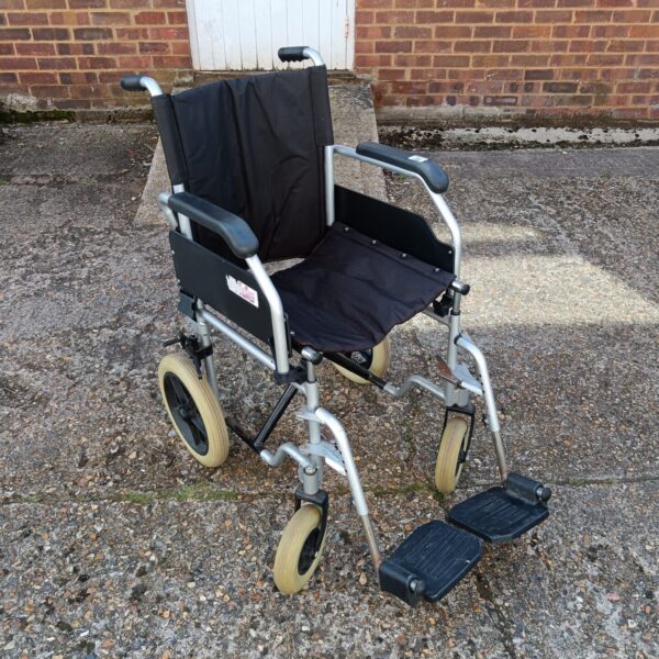 Silver folding wheelchair with black seat, a practical mobility aid.