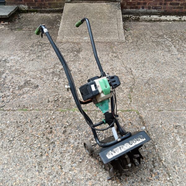 Petrol garden rotavator for soil cultivation and preparation.