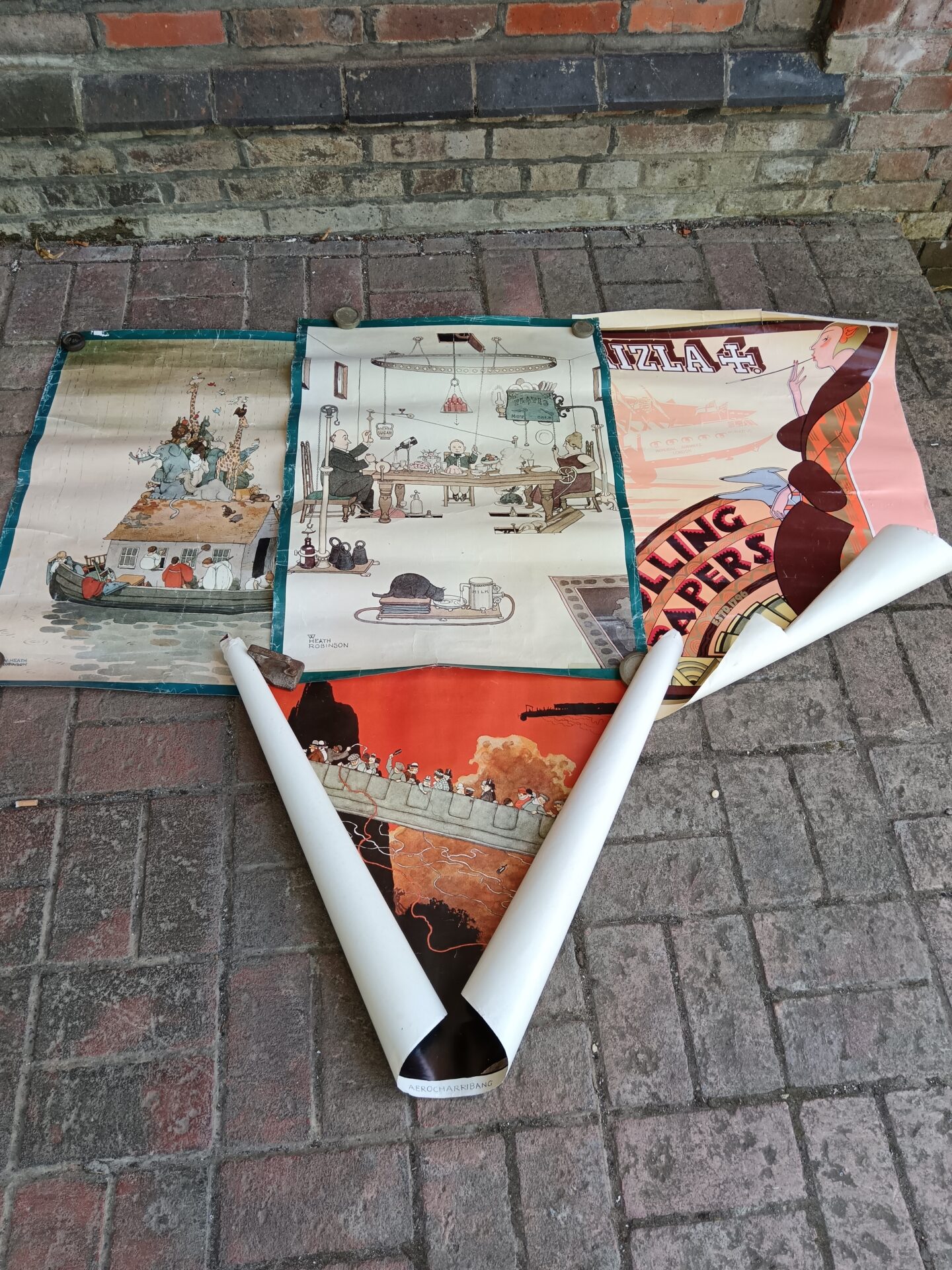 759 Four vintage posters including w heath Robinson & rizla
