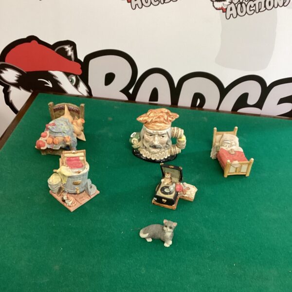 Close-up of miniature pirate ornaments in a collectible lot.