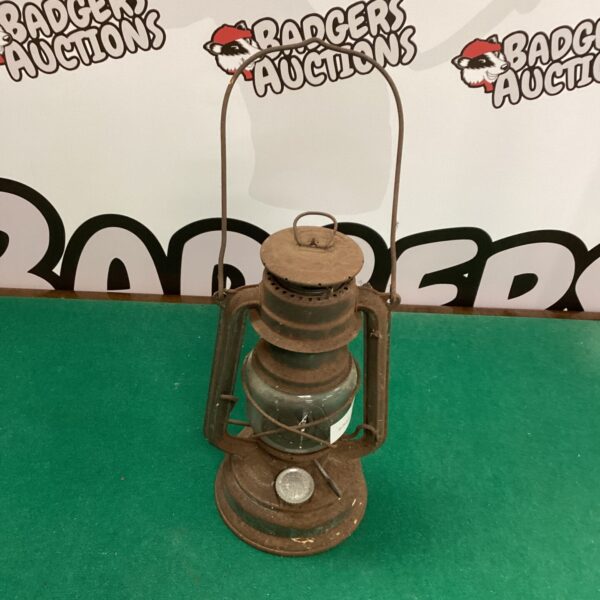 Vintage Tilley lamp with clear glass globe and brass body.