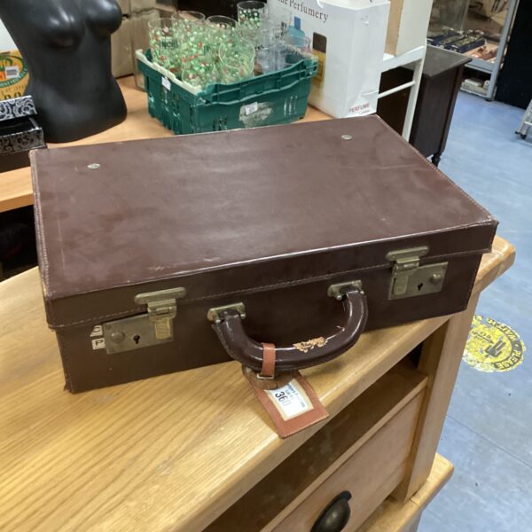 Vintage brown leather child's travel case, antique luggage.