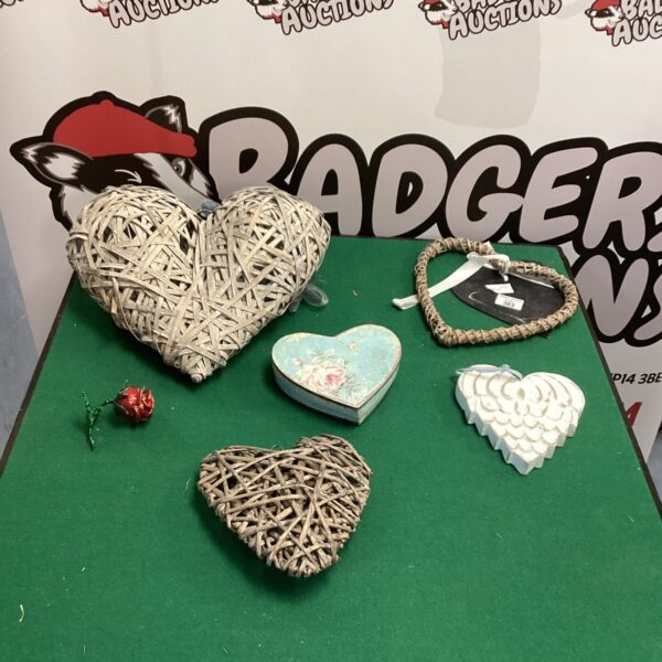 Set of three woven wicker heart decorations for rustic home decor.