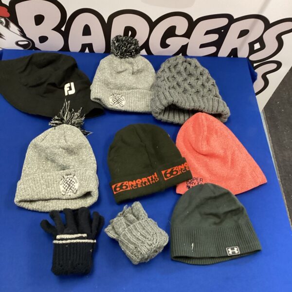 A collection of golf and winter hats and gloves.