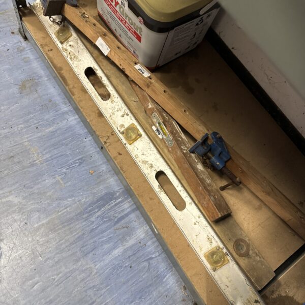 Vintage spirit levels and sash clamp lot for woodworking projects.