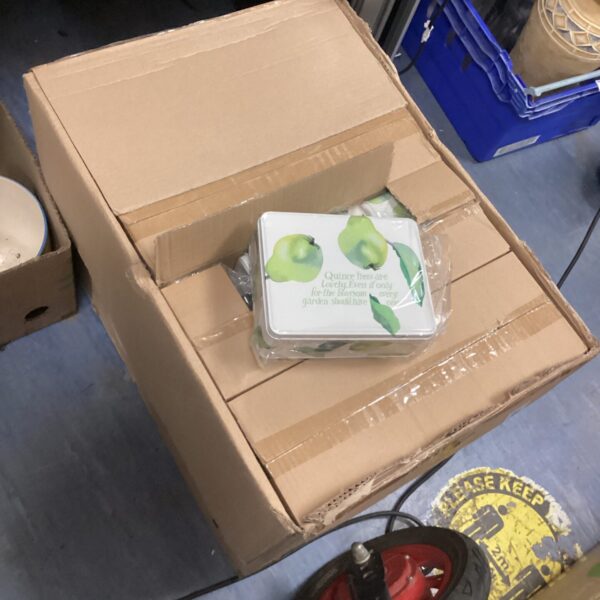 Large box of new Emma Bridgewater quince tins for kitchen storage.