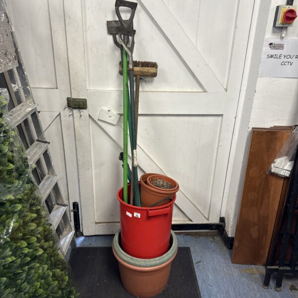 Garden tools bundle including spade, fork, and plastic pot.