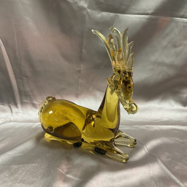 Vintage amber glass reindeer figurine, mid-century modern style.