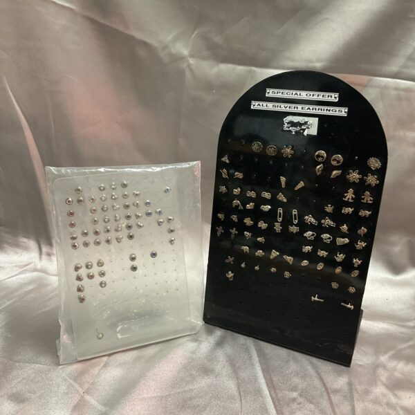 Silver stud earrings displayed on original cards, fashion jewellery lot.