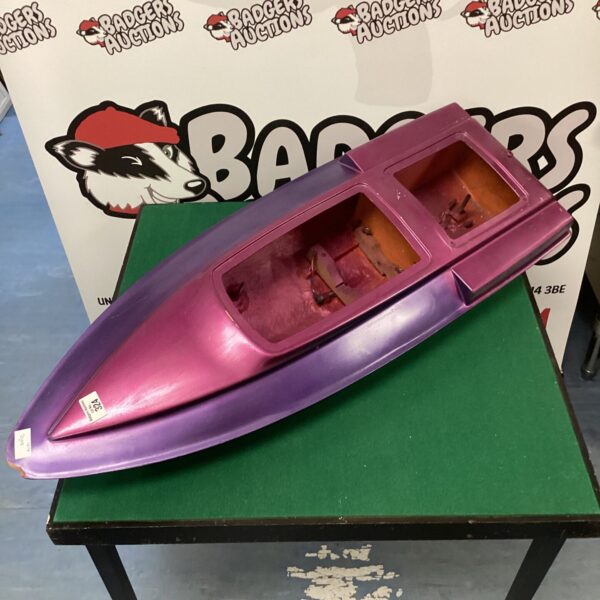 Purple vintage model boat hull for hobbyists and collectors.