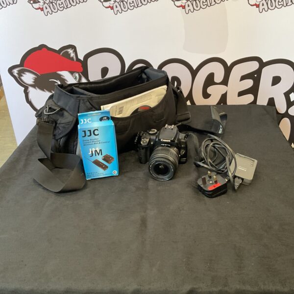 Canon 400D digital SLR camera with case and remote control.