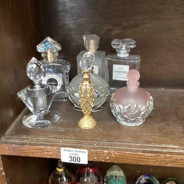 Vintage perfume bottles displayed in a collection, antique glass.