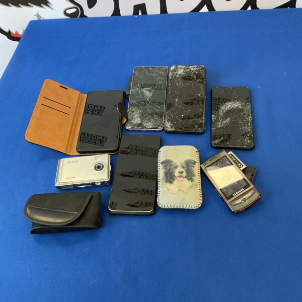 Vintage Samsung smartphones and Hitachi camera lot for collectors.
